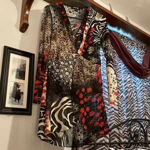 Xs cami top and jacket. Fits more like a small. Polyester and spandex Material.